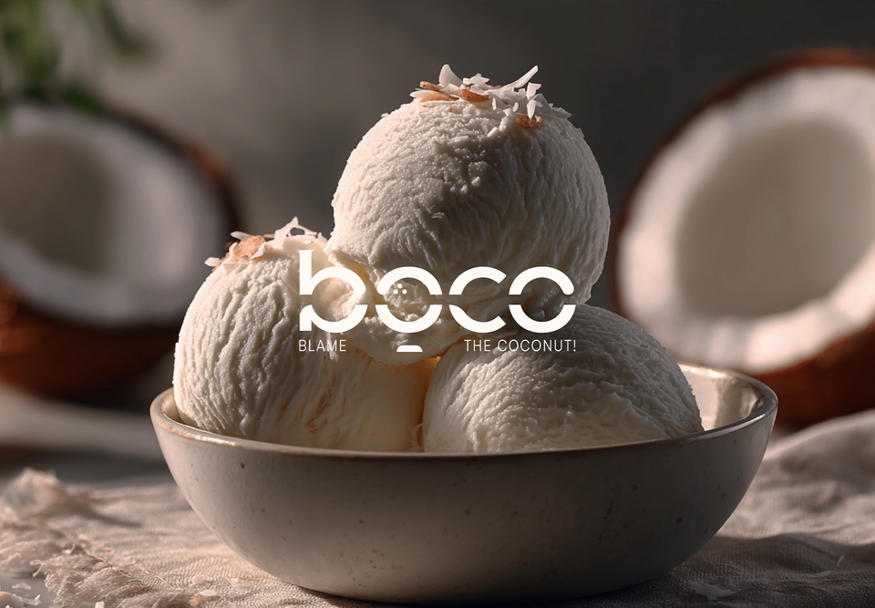 รับออกแบบ CI ออกแบบ brand identity ไอศกรีมกะทิสามลูกในถ้วยสวยงาม พร้อมโลโก้ Boco "Blame the Coconut" บนพื้นหลังที่มีมะพร้าวผ่าซีก แสดงถึงการออกแบบ CI สำหรับธุรกิจอาหาร โลโก้สินค้า, การสร้างแบรนด์, การตลาด, ออกแบบโลโก้, บริษัทออกแบบ CI